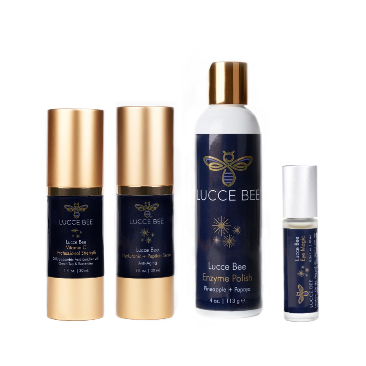 Lucce Bee skincare essentials set featuring Vitamin C Serum, Hyaluronic + Peptide Serum, Enzyme Polish with Pineapple + Papaya, and Eye Magic roller for bright, youthful skin