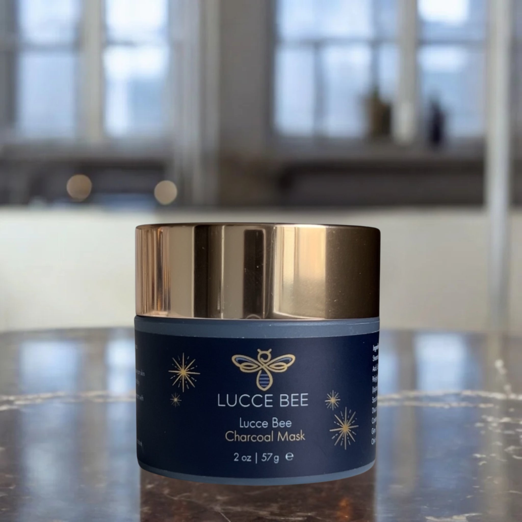 Lucce Bee Charcoal Mask – Luxury Skincare Jar for Detoxifying and Purifying Skin, Displayed on Marble Bathroom Counter (2 oz)