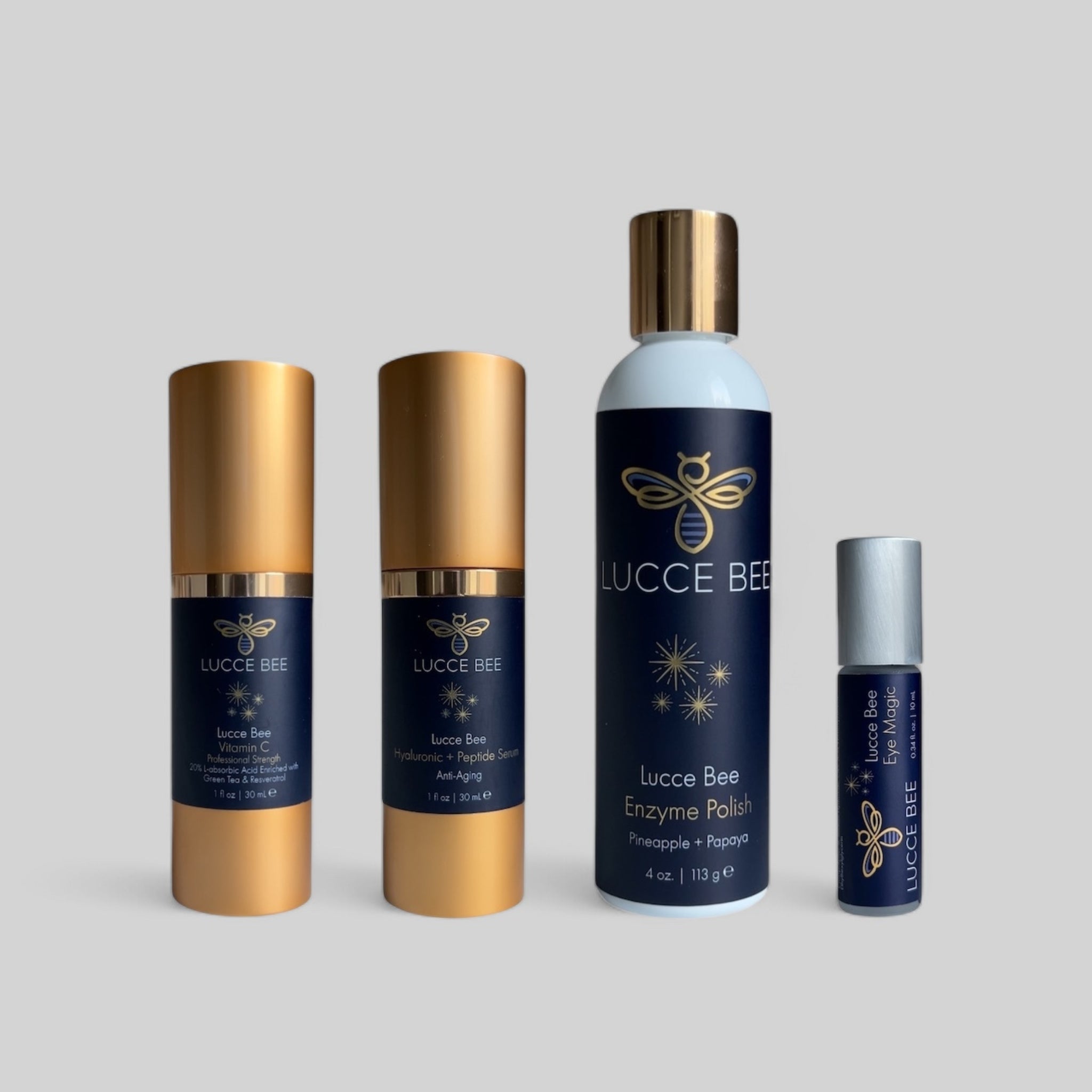 Lucce Bee luxury skincare set with Vitamin C Serum, Hyaluronic + Peptide Serum, Enzyme Polish with Pineapple + Papaya, and Eye Magic roller for radiant, youthful skin