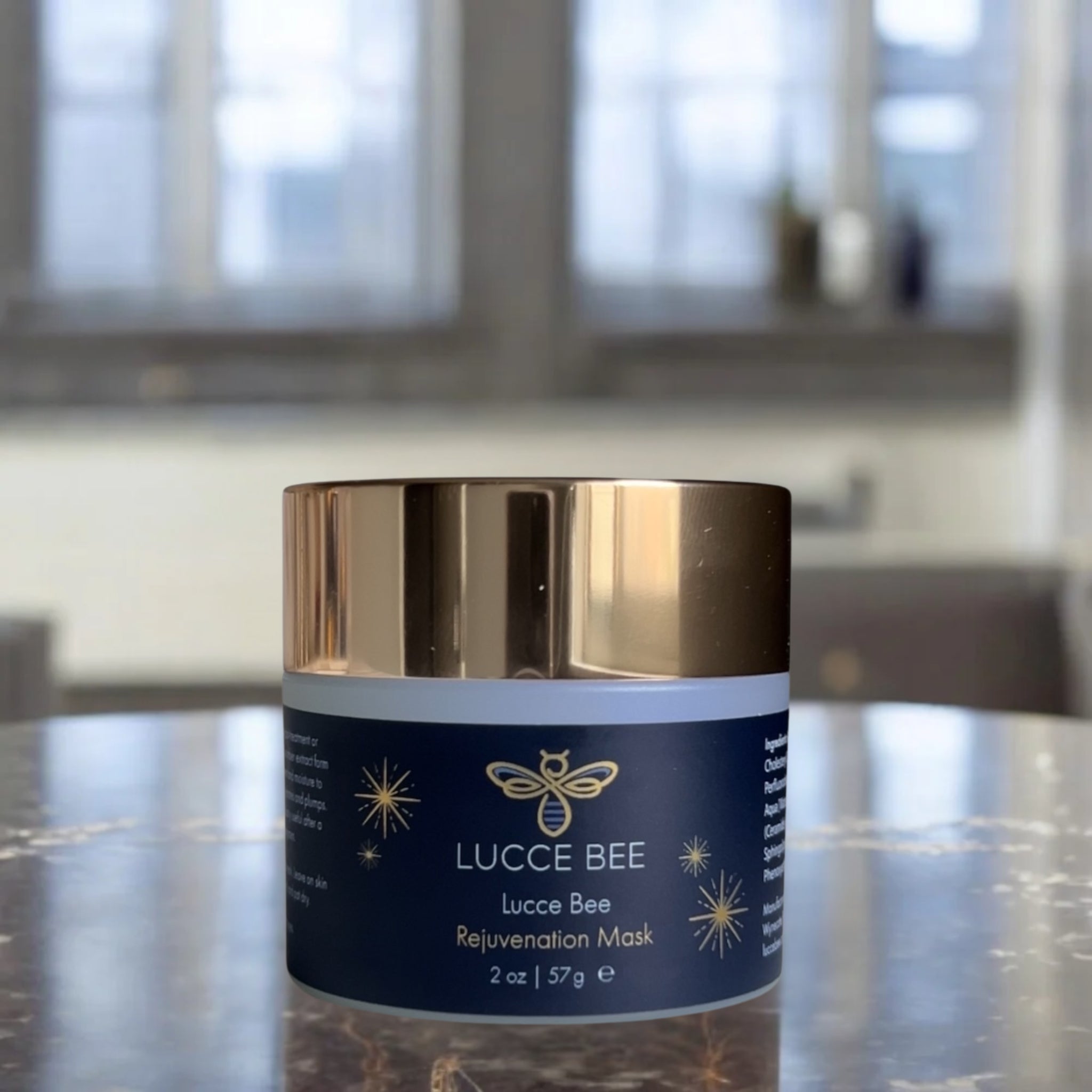 Lucce Bee Rejuvenation Mask – Luxurious Skincare Jar for Hydrating and Firming Tired, Dehydrated Skin, Displayed on Marble Counter (2 oz)
