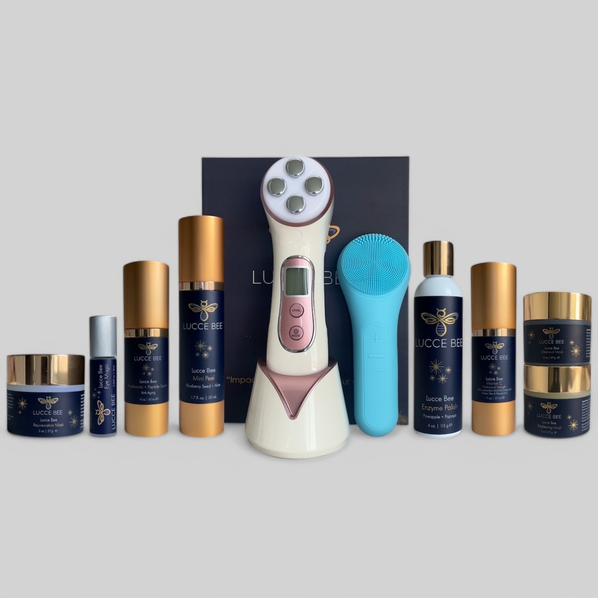 Complete Lucce Bee luxury skincare collection featuring masks, serums, eye treatment, Enzyme Polish, Mini Peel, and advanced facial tools including blue Thermal Sonic Brush and LED therapy device for radiant, youthful skin