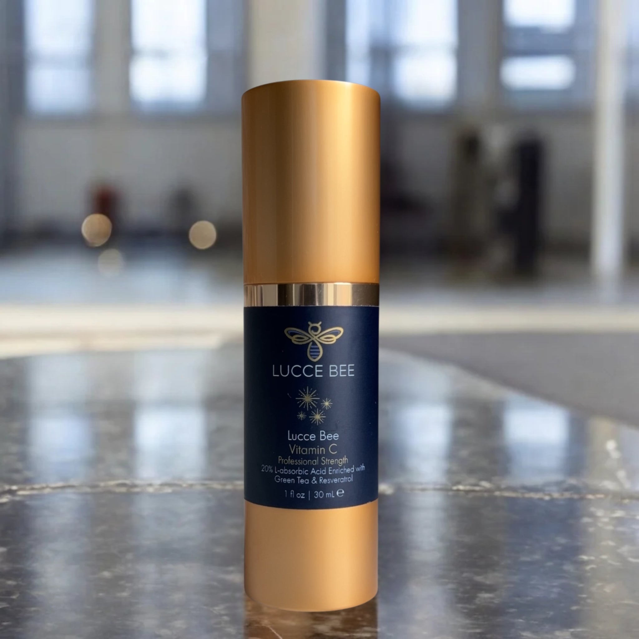 Lucce Bee Vitamin C Serum – 20% L-Ascorbic Acid with Green Tea and Resveratrol for Brightening and Firming Skin, 1 fl oz Bottle on Bathroom Countertop