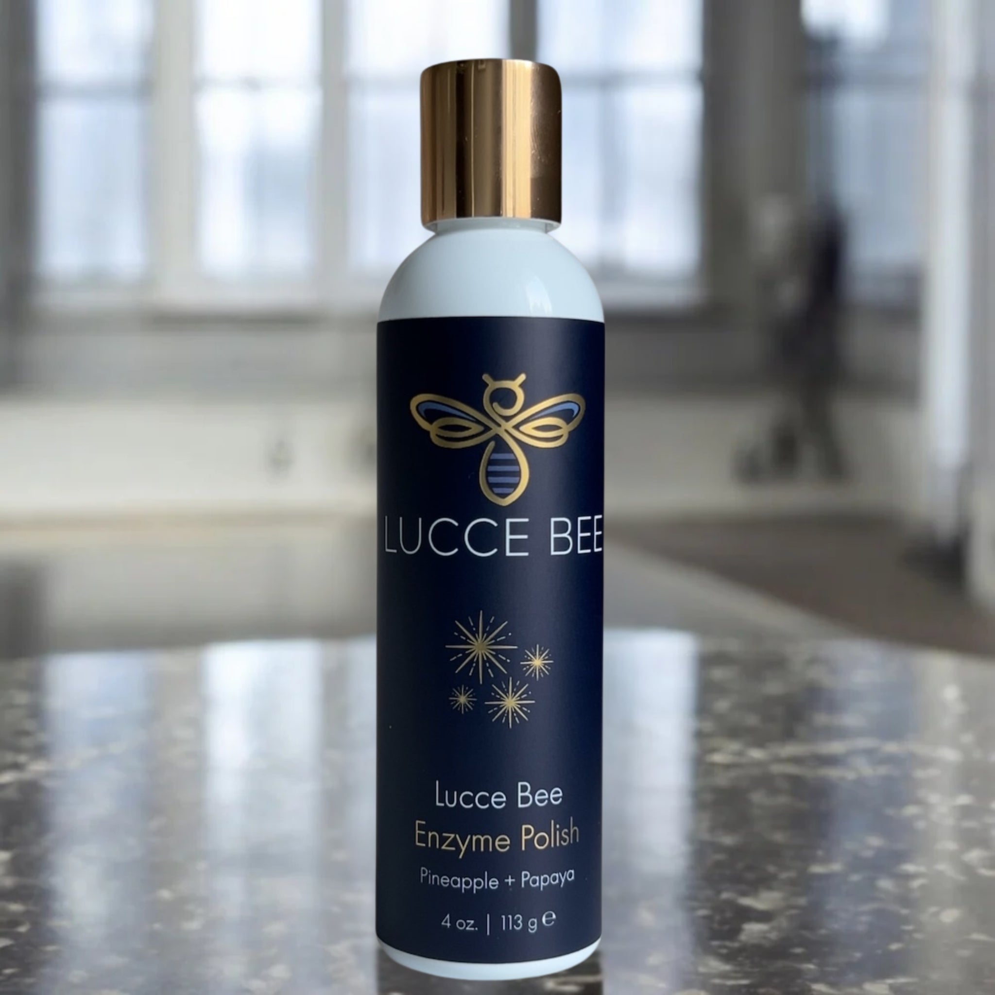 Lucce Bee Enzyme Polish – Pineapple and Papaya Exfoliating Powder for Bright, Smooth Skin, Displayed on Marble Countertop (4 oz)