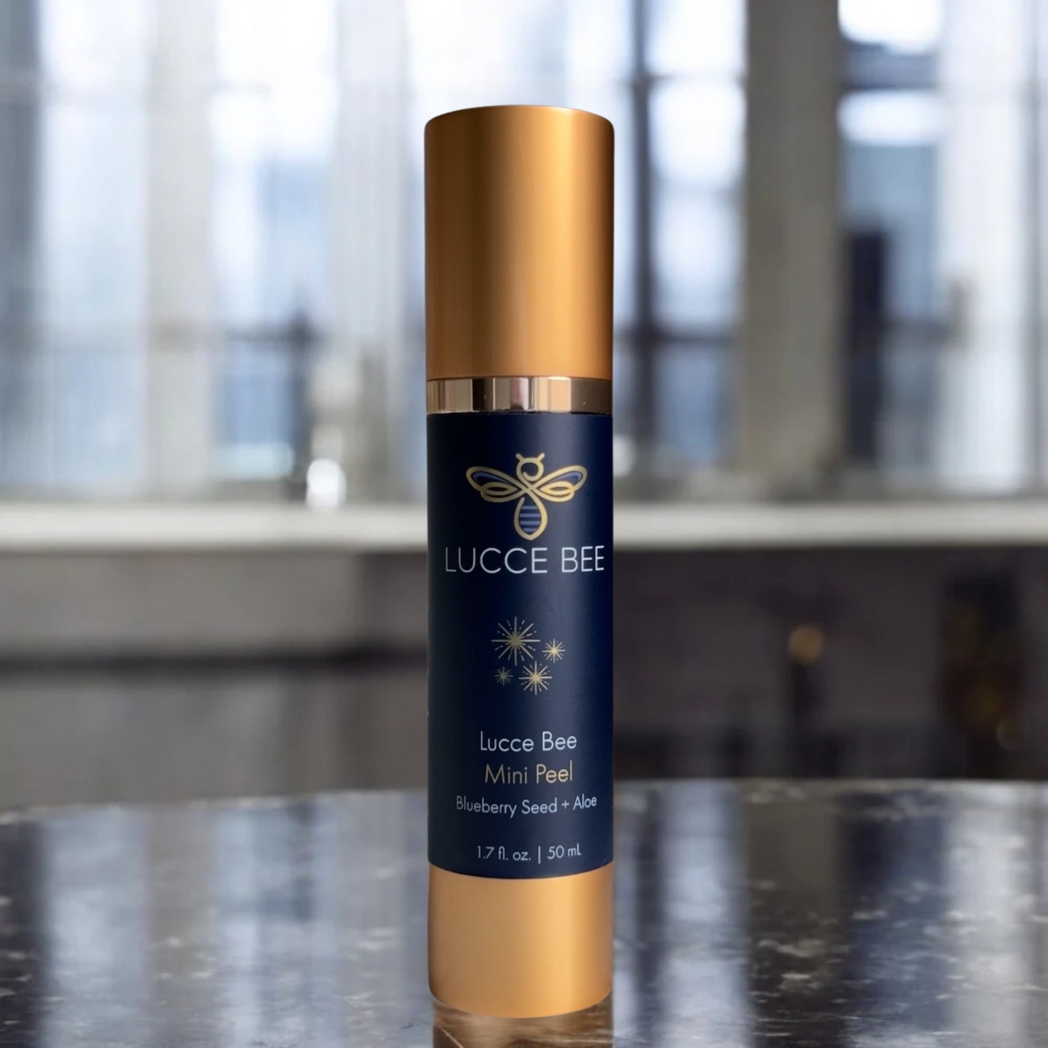 Lucce Bee Mini Peel Exfoliating Treatment with Blueberry Seed and Aloe – Luxury Skincare Bottle Displayed on Bathroom Countertop (1.7 fl oz / 50 mL)