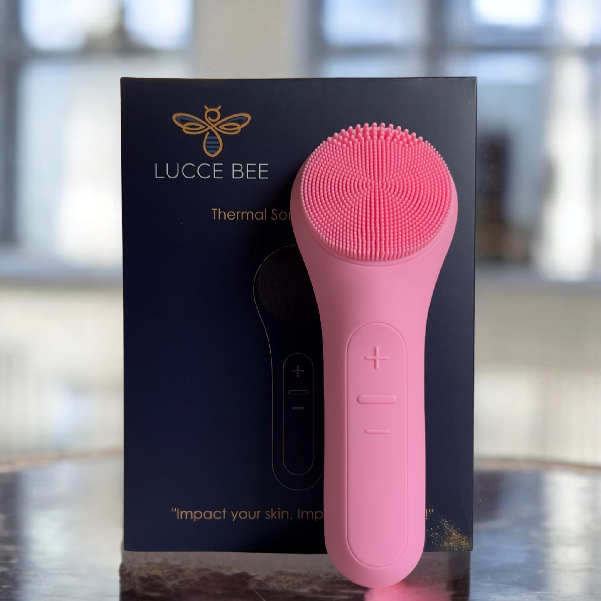 Lucce Bee Thermal Sonic Facial Cleansing Brush – Pink Silicone Skincare Tool for Deep Cleaning and Exfoliation, Displayed with Luxe Packaging
